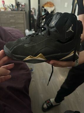 Jordan Black and Gold High-Top Sneaker
